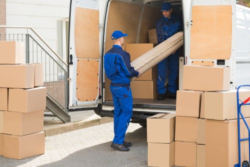 Removal van and moving team on a Clapham residential street