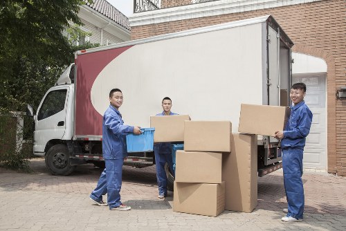 Man with a van loading furniture in Clapham residential street