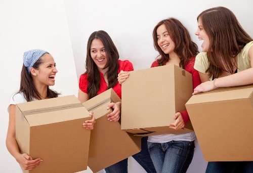Removal team handling a home move in Clapham near residential flats