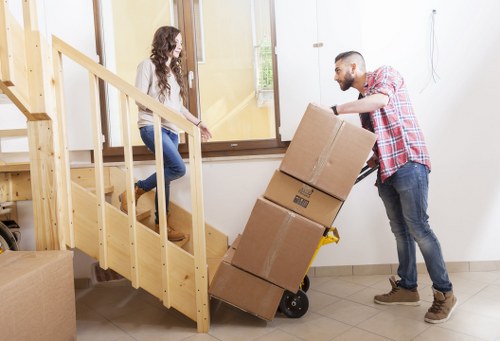 Packed boxes and furniture prepared for a home move in Clapham
