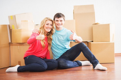 Professional office move team handling furniture transport in Clapham