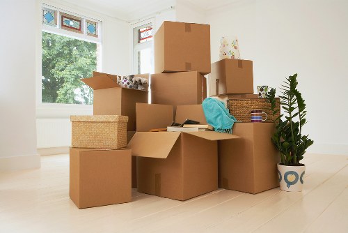 Packed boxes and furniture ready for a house move in Clapham