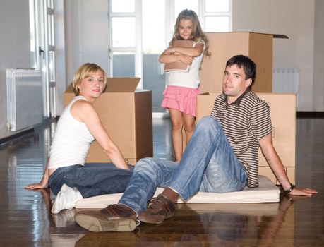 Local removals team planning a move in Clapham with boxes and trolley